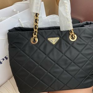 Prada tote bag but also has a leather strap for cross body!